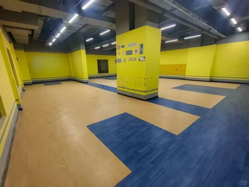 Reviewing technical sports flooring certification documents with a factory engineer